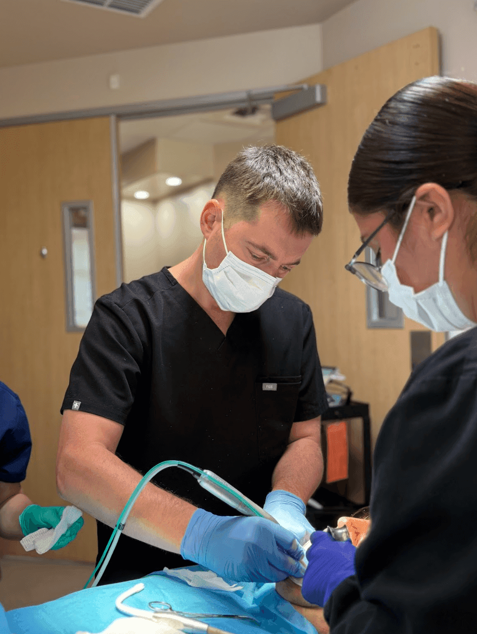 Dr. Alexander Antipov performing dental implant surgery