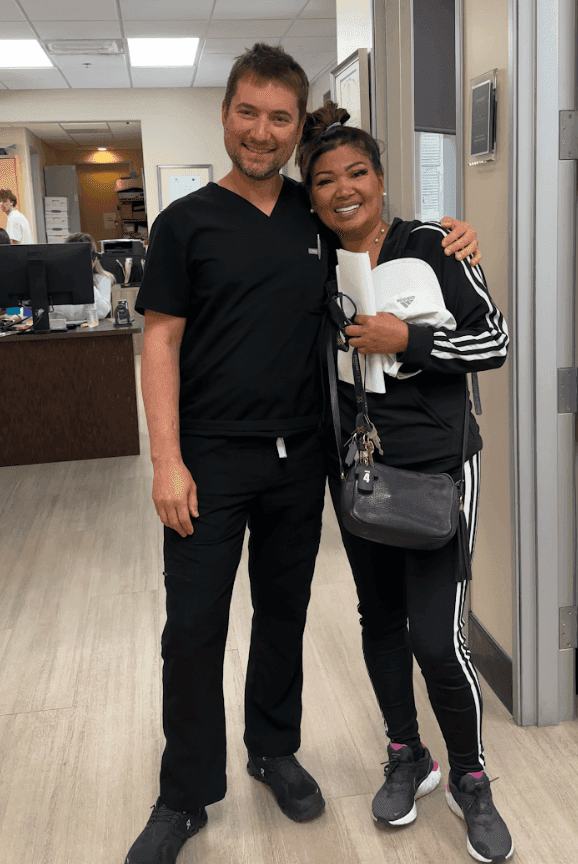 Dr. Alexander Antipov with a happy patient